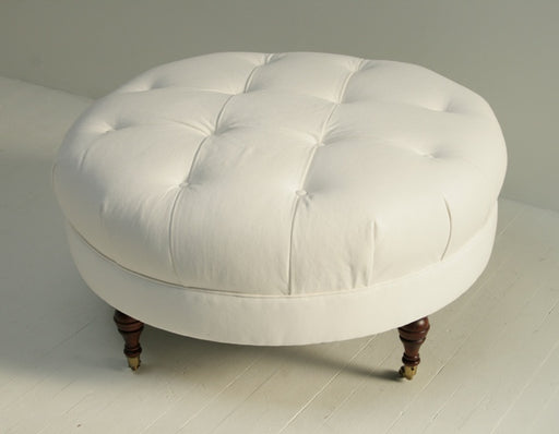 White Denim Tufted Ottoman with Turned Legs and Casters 8