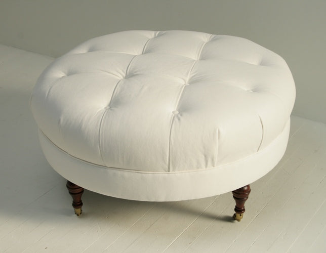 White Denim Tufted Ottoman with Turned Legs and Casters 8