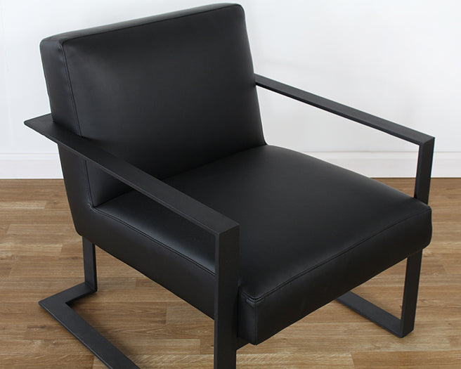 Black Leather Lounge Chair On Black Base